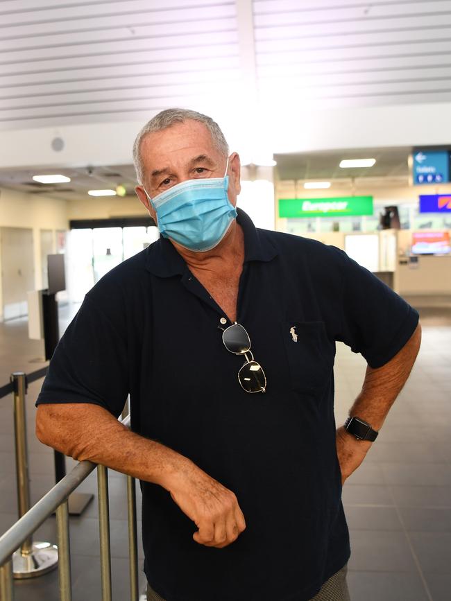 Jan Flis waits for his grandson and his grandson’s girlfriend at Darwin International Airport. Picture: Katrina Bridgeford