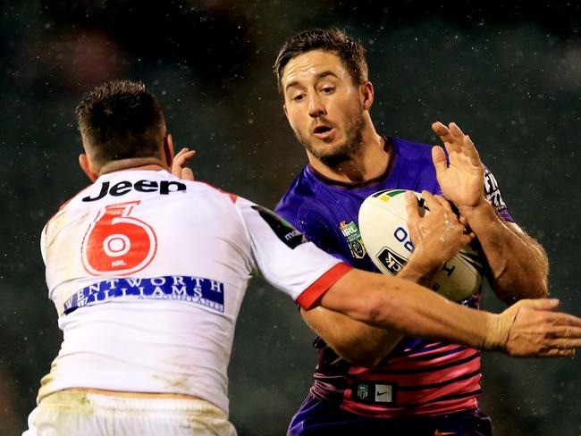 Ben Hunt of the Broncos tackled by Gareth Widdop of the Dragons during the St George Illawarra Dragons v Brisbane Broncos round 22 NRL game at WIN Stadium, Wollongong. pic Mark Evans