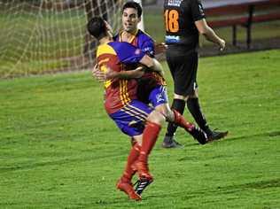 KSS Jets player Liam Previtera embraces Jordan Dowden after Previtera scored to guide the side into the FFA Cup final for Wide Bay. Picture: Shane Jones