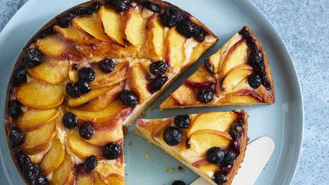 Delicious: peach and blueberry yogurt cake. Picture: Guy Bailey