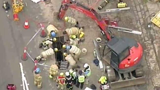 Dozens of firefighters worked to free the man. Picture: Seven News