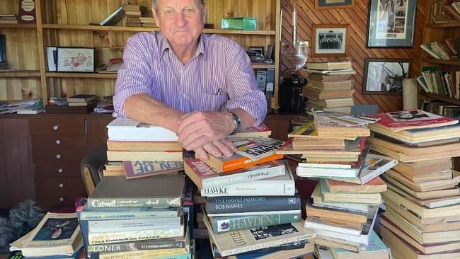Robb Schwarten and his collection of books gathered since the 1890s.
