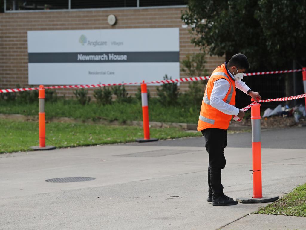 Security putting tape up at the entrance to Anglicare's Newmarch House. Picture: Richard Dobson