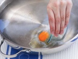 Bring a large deep frying pan of water to the boil and slide in the eggs.