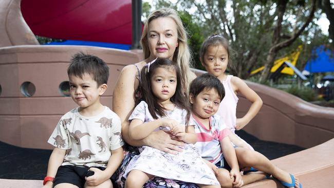 Isaac, Elsie, Aimee, Asher and Ivy Phomsouvanh in a Brighton park. Aimee said mozzies were prolific throughout the area as a result of the Boondall wetlands. Picture: Attila Csaszar/AAP