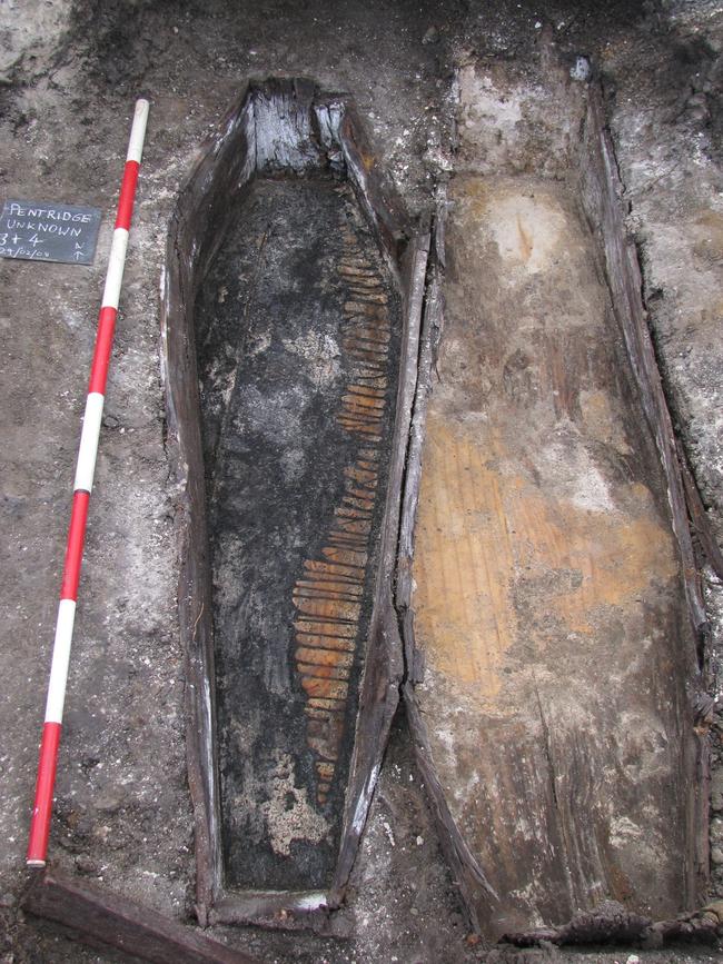 A coffin is dug up at the Old Melbourne Gaol.