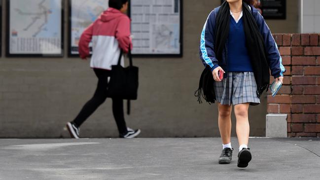 A school student is seen at Strathfield Train Station in Sydney. An estimated 18,000 children will join commuters from February 6. Picture: Bianca De Marchi