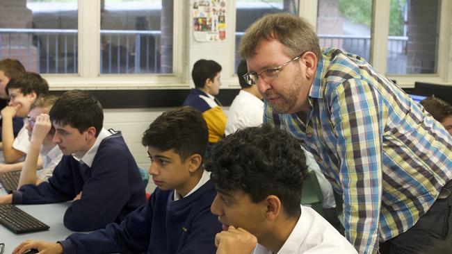 Grok Academy chief executive Dr James Curran running a cyber security demonstration with students in Sydney.