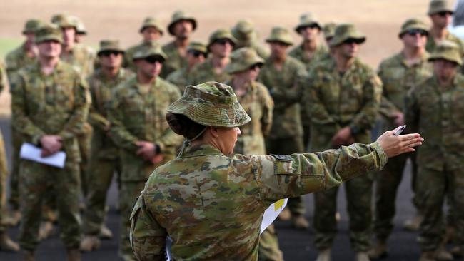 Australian Army Reserve and regular personnel during roll call ahead of departing the Holsworthy Barracks to support bushfire efforts across NSW. Picture: AAP/Danny Casey