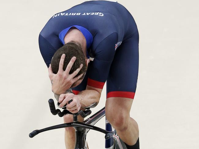 A physically shattered Bradley Wiggins after winning gold. Picture: Adam Head