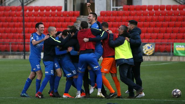 Adelaide Olympic players celebrate their FFA Cup SA final win over Adelaide City at Hindmarsh Stadium. Picture: AAP/Emma Brasier