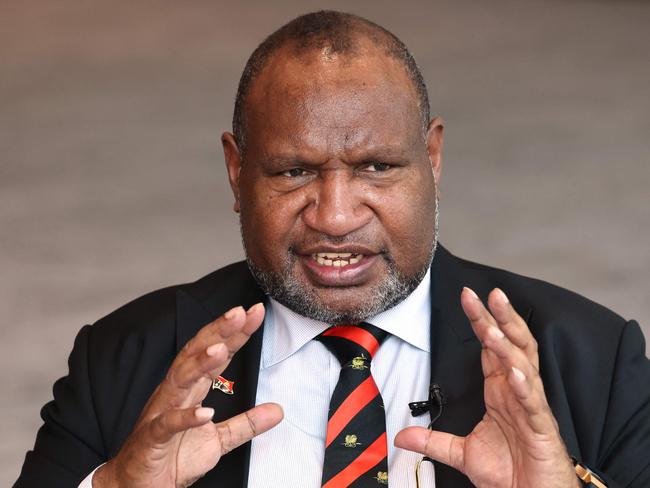 Papua New Guineaâs Prime Minister James Marape reacts as he speaks during an interview in Sydney on December 11, 2023. (Photo by DAVID GRAY / AFP)