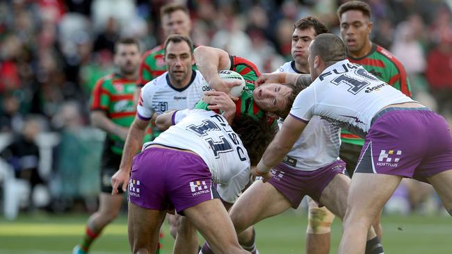 Cam Murray is dragged to the ground by his neck. Picture: Shane Myers/NRL Photos