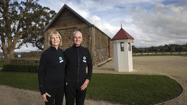 RESTORATION: David and Susan Shannon at the convict-built barn on their Waterton Hall vineyard property at Rowella in the Tamar Valley. Picture: CHRIS KIDD