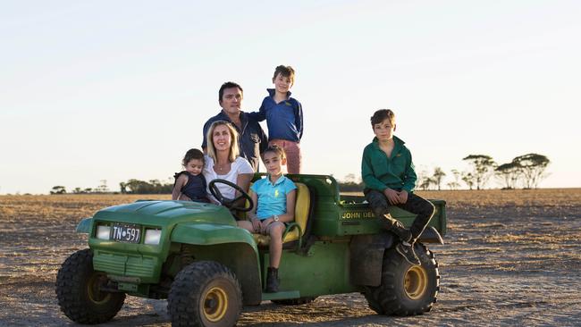 Fine returns: Brad Jones and Kate Raston with children Nina, Zoe, Sam and Alex.