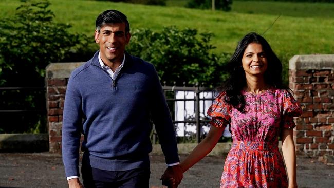 British Prime Minister Rishi Sunak and his wife Akshata Murty arrive to cast their votes during the general election. Picture: Getty Images