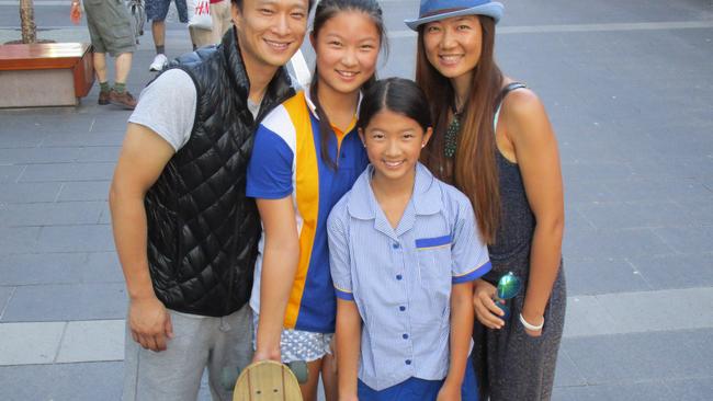 Chinese immigrants down Cavill Mall (from left) Yun Wang, daughter Jin Jin Wang, 11, Xiao Xiao Wang, 10, and Bobo Shi want to relocate permanently from Shangai to Surfers Paradise