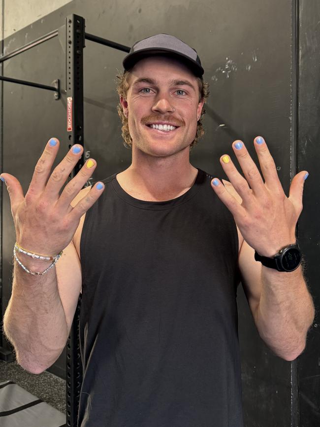 Matt LaFontaine shows off his colouful fingernails.