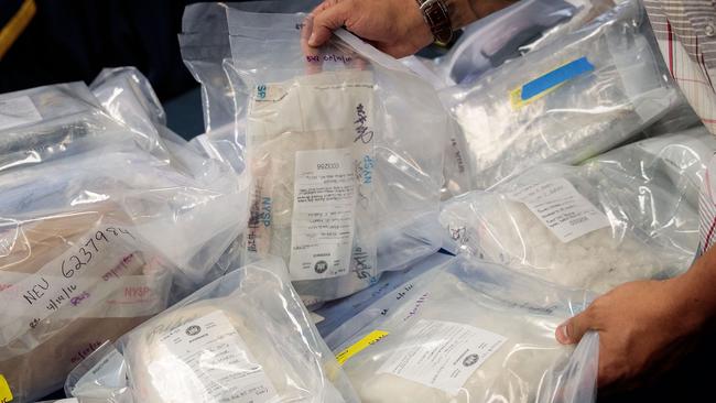 NEW YORK, NEW YORK - SEPTEMBER 23: A law enforcement official organizes bags of heroin to be displayed before a press conference regarding a major drug bust, at the office of the New York Attorney General, September 23, 2016 in New York City. New York State Attorney General Eric Scheiderman's office announced Friday that authorities in New York state have made a record drug bust, seizing 33 kilograms of heroin and 2 kilograms of fentanyl. According to the attorney general's office, it is the largest seizure in the 46 year history of New York's Organized Crime Task Force. Twenty-five peopole living in New York, Massachusetts, Pennsylvania, Arizona and New Jersey have been indicted in connection with the case.   Drew Angerer/Getty Images/AFP == FOR NEWSPAPERS, INTERNET, TELCOS & TELEVISION USE ONLY ==