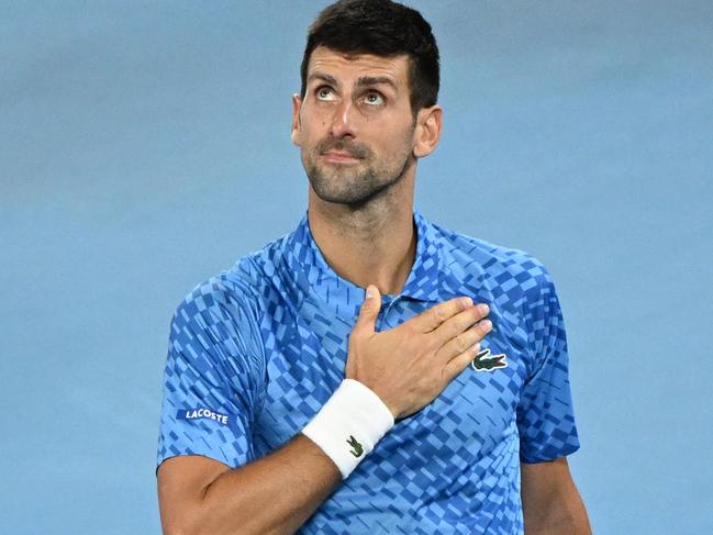 Serbia's Novak Djokovic celebrates after victory against Australia's Alex De Minaur during their men's singles match on day eight of the Australian Open tennis tournament in Melbourne on January 23, 2023. (Photo by WILLIAM WEST / AFP) / -- IMAGE RESTRICTED TO EDITORIAL USE - STRICTLY NO COMMERCIAL USE --