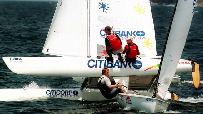 Finn class sailor Paul McKenzie (foreground) gets out of way of Darren Bundock & John Forbes in a race in the 1990s.