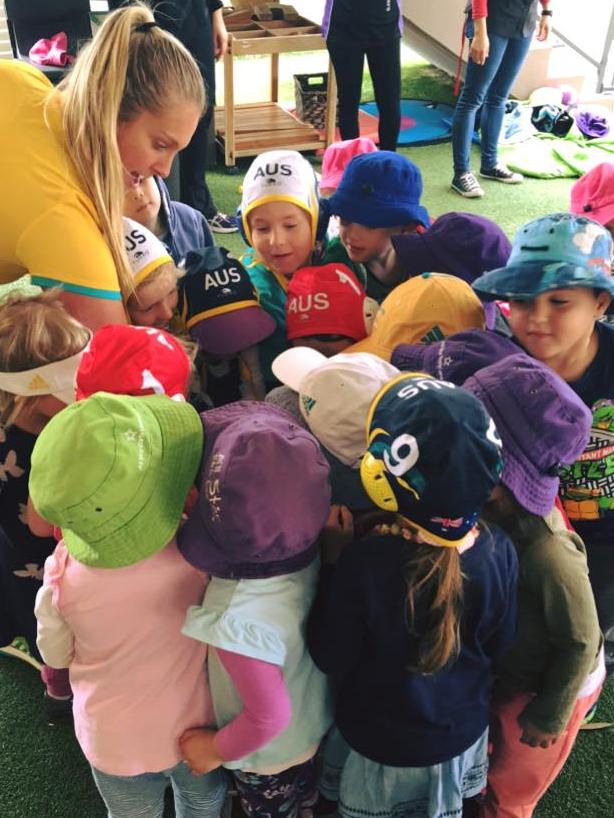 Showing the kids at All Stars Early Learning Centre Botany her polo gear.