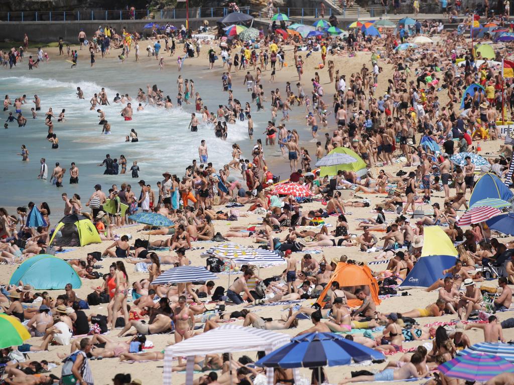 The huge amount of people packing the sand seemed to make social distancing almost impossible for many beachgoers. Picture: Christian Gilles/NCA NewsWire