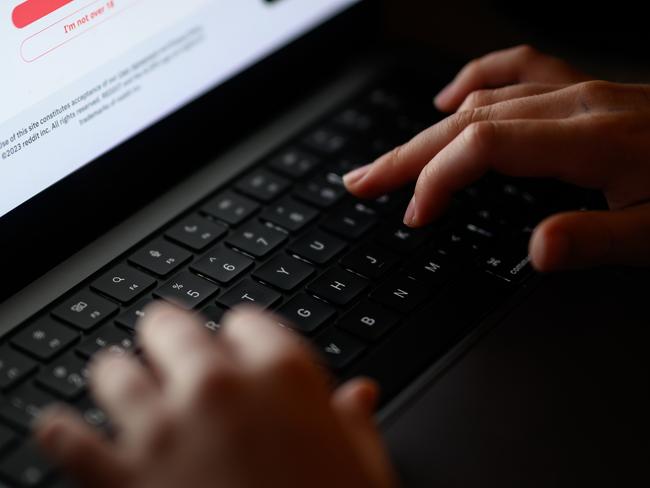 LONDON, ENGLAND - JANUARY 17: In this photo illustration, a teenage child looks at a screen of age-restricted content on a laptop screen on January 17, 2023 in London, England. The Bill aims to protect young and vulnerable viewers by introducing new rules for social media companies which host user-generated content, and for search engines, which will have tailored duties focussed on minimising the presentation of harmful search results. Content that platforms will need to remove includes child sexual abuse material, revenge pornography, selling illegal drugs or weapons, and terrorism. (Photo by Leon Neal/Getty Images)