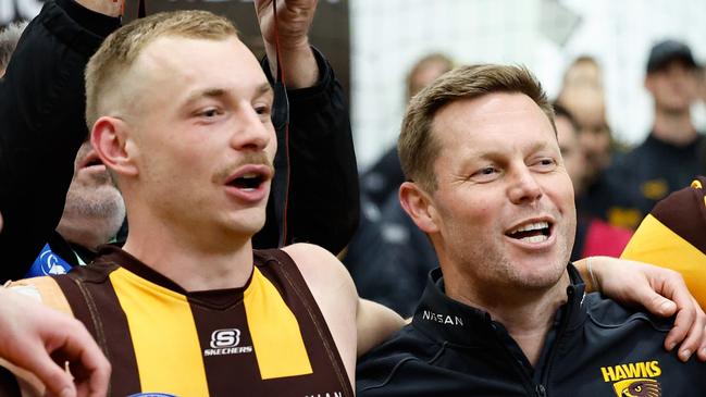 MELBOURNE, AUSTRALIA - SEPTEMBER 06: Sam Mitchell, Senior Coach of the Hawks sings the team song during the 2024 AFL Second Elimination Final match between the Western Bulldogs and the Hawthorn Hawks at The Melbourne Cricket Ground on September 06, 2024 in Melbourne, Australia. (Photo by Dylan Burns/AFL Photos via Getty Images)