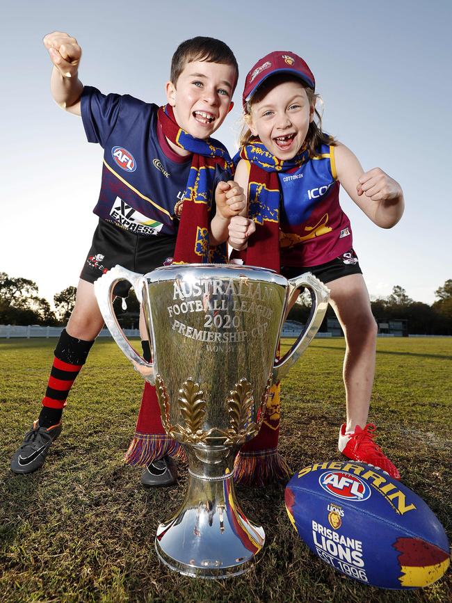 Charlie Whiting, 7, and Josie Walsh, 8, with the 2020 AFL Grand Final Cup. Picture: Josh Woning