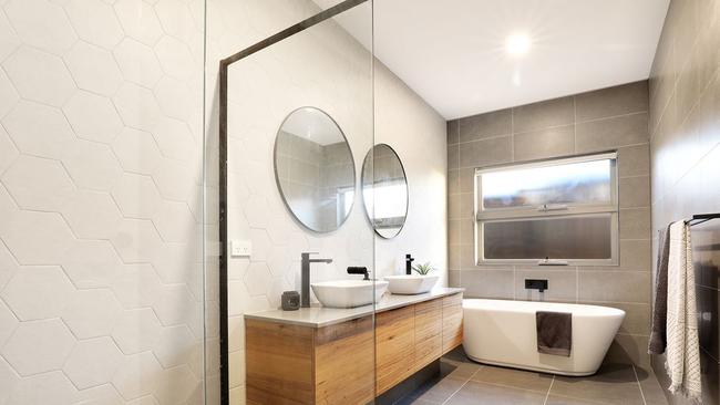 A floating timber vanity features in this bathroom.