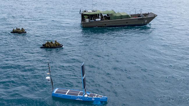 Australian Defence Force soldiers from Regional Force Surveillance Unit deploy from a LCM-8 landing craft on Zodiac boats alongside the Blue Bottle maritime surveillance vessel deployed on Operation Resolute, near Winy Alkan Island. *** Local Caption *** From 10-22 October 2022, Australian Defence Force personnel deployed from Darwin to conduct long-range patrols on remote islands off Western Australia as part of Operation RESOLUTE.  The patrols searched the islands for foreign fishing vessels and evidence of illegal activities by conducting foot patrols, water patrols, observation posts, and information gathering. Operation RESOLUTE is the Australian Defence Force (ADF) contribution to the whole of government (WoG) effort to protect Australiaâs borders and offshore maritime interests.