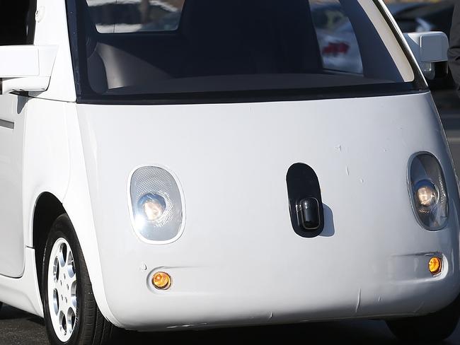 MOUNTAIN VIEW, CA - FEBRUARY 02: U.S. Transportation Secretary Anthony Foxx inspects a Google self-driving car at the Google headquarters on February 2, 2015 in Mountain View, California. U.S. Transportation Secretary Anthony Foxx joined Google Chairman Eric Schmidt for a fireside chat where he unveiled Beyond Traffic, a new analysis from the U.S. Department of Transportation that anticipates the trends and choices facing our transportation system over the next three decades. Justin Sullivan/Getty Images/AFP == FOR NEWSPAPERS, INTERNET, TELCOS & TELEVISION USE ONLY ==