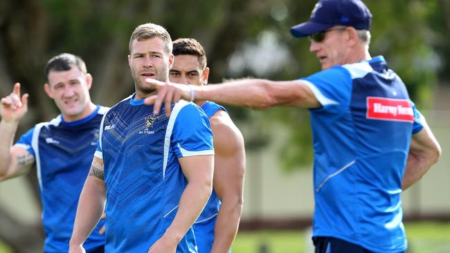 Trent Merrin listens to Wayne Bennett during NRL All Stars training at Runaway Bay. Pics Adam Head