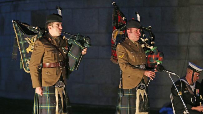 Bagpipe players at this morning’s Anzac Day dawn service in Melbourne. Picture: AAP Image/David Crosling