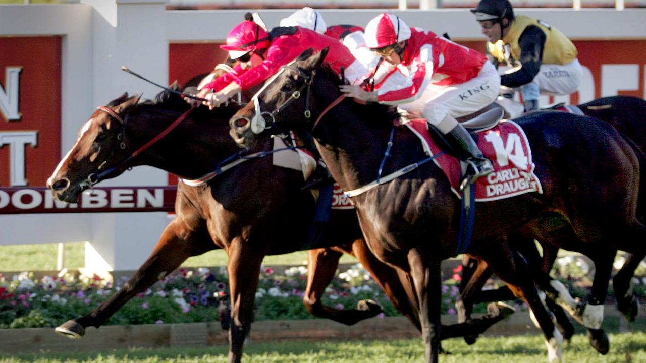 MAY 21, 2005 : Racehorse Red Oog (C) ridden by jockey Hugh Bowman winning race 7, the Doomben 10,000 at Doomben in Brisbane, 21/05/05. Turf A/CT