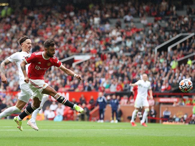MANCHESTER, ENGLAND - AUGUST 14: Bruno Fernandes of Manchester United scores their side's fourth goal and his hat-trick during the Premier League match between Manchester United  and  Leeds United at Old Trafford on August 14, 2021 in Manchester, England. (Photo by Catherine Ivill/Getty Images,)
