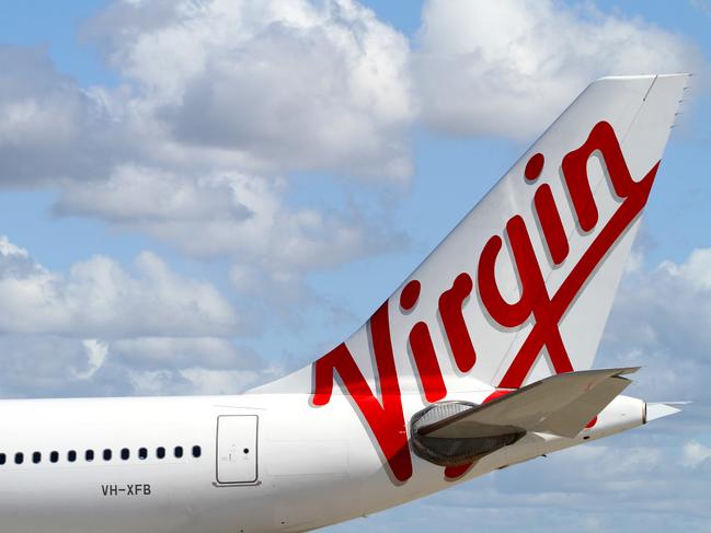 The new Virgin Australia logo on the tail of one of the Airbus A330 aircraft during announcement of rebranding from Virgin Blue at Sydney Airport in Sydney.