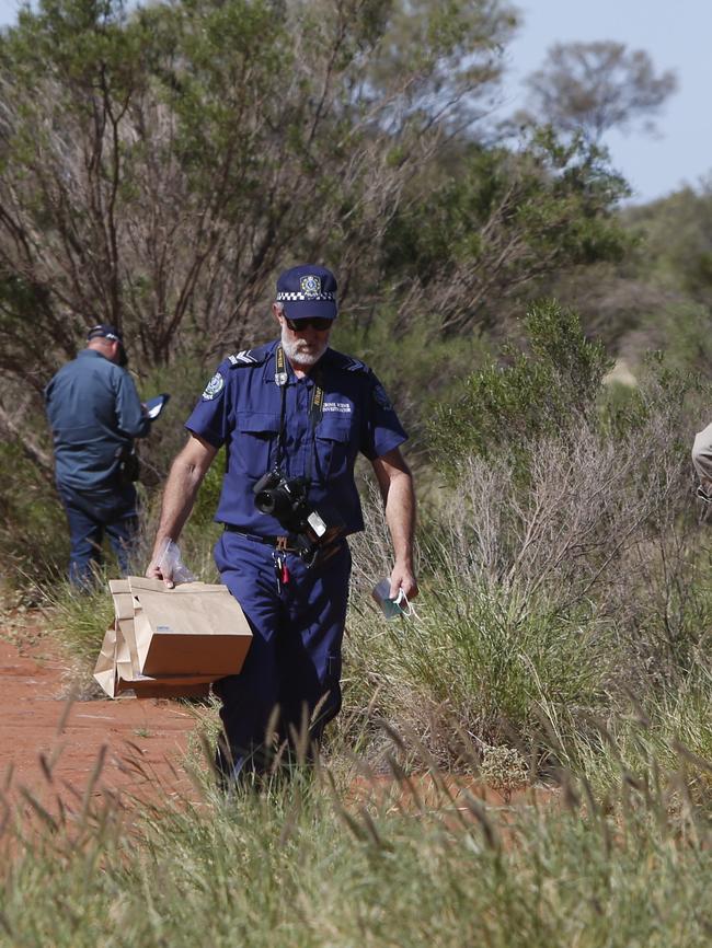 Forensic police officers at Fregon, in the APY Lands, after Ms Woodford was murdered. Picture: Simon Cross