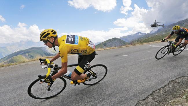 Britain's Chris Froome, wearing the overall leader's yellow jersey.