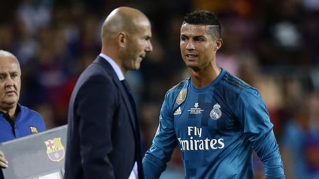 Real Madrid's Cristiano Ronaldo, right, reacts after referee Ricardo de Burgos showed a red card.