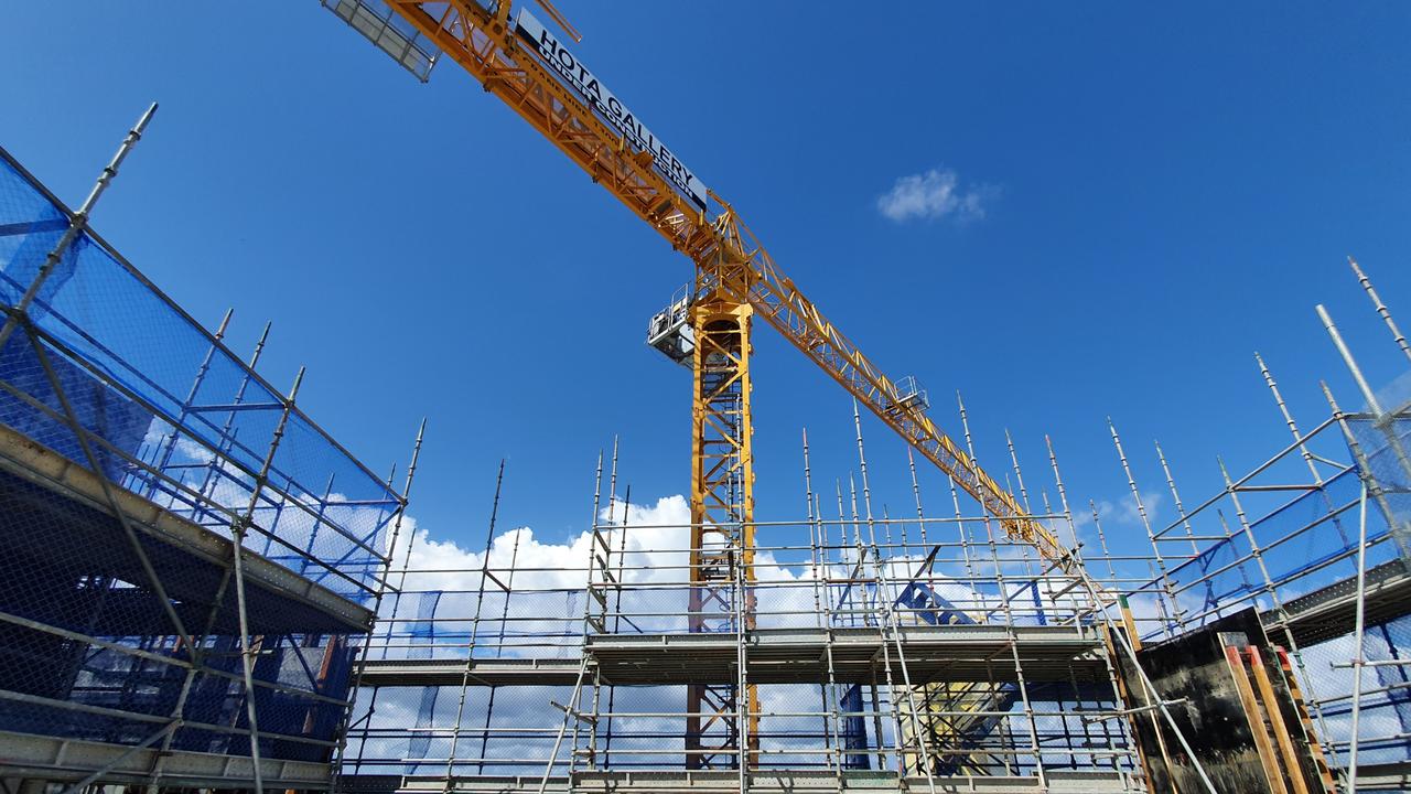 A crane operating on top of the construction site. Picture: Luke Mortimer