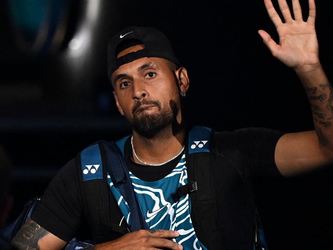 Australia's Nick Kyrgios waves as he arrives to play an exhibition match against Serbia's Novak Djokovic ahead of the Australian Open tennis tournament in Melbourne on January 13, 2023. (Photo by WILLIAM WEST / AFP) / --IMAGE RESTRICTED TO EDITORIAL USE - STRICTLY NO COMMERCIAL USE--