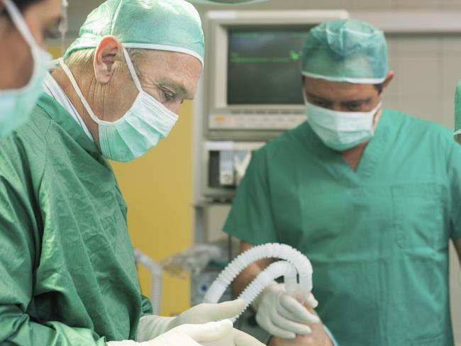 Surgery team operating