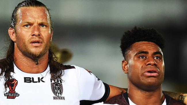 An emotional Kevin Naiqma (right) alongside Ashton Sims singing the Fijian national anthem. Picture: Zak Simmonds