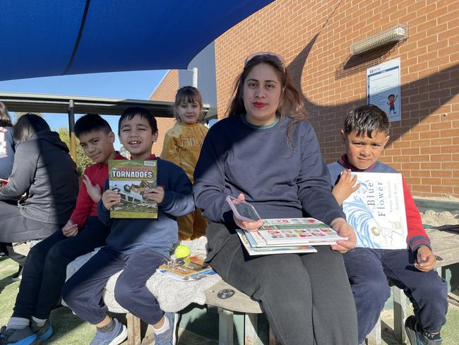 Albanvale Primary School: Meshach, Abednego, Luisa and Elijah reading in the shade at Albanvale Primary School's book week event. Picture: Athos Sirianos