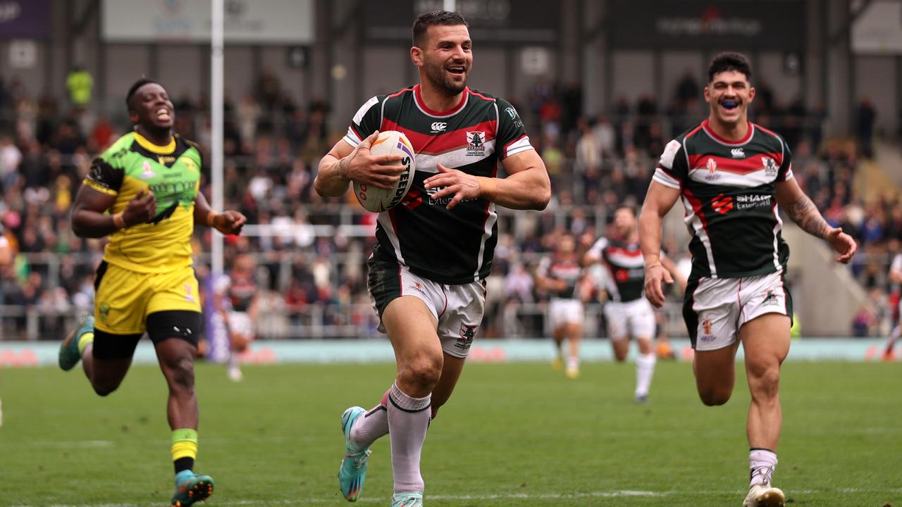 LEIGH, ENGLAND - OCTOBER 30: Josh Mansour of Lebanon goes over to score their sides eleventh try during Rugby League World Cup 2021 Pool C match between Lebanon and Jamaica at Leigh Sports Village on October 30, 2022 in Leigh, England. (Photo by Charlotte Tattersall/Getty Images for RLWC)