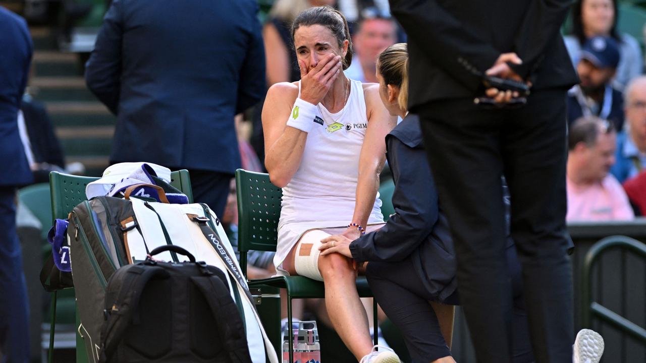 The trainer treats her. Picture: Glyn Kirk/AFP