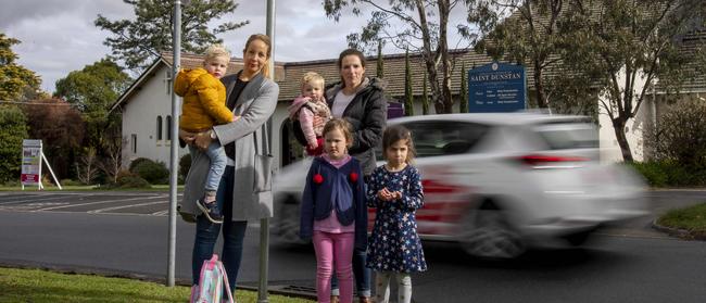 Simone McKenzie, (left), with her son Jack, 3, says drivers should slow down to 40km/h as they pass kindergartens. Picture: Andy Brownbill