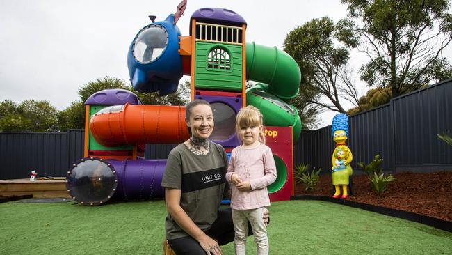 Maggie Brennan and daughter Murphy, 3, have a second-hand McDonald’s playground in their backyard in Darley. Picture: Aaron Francis